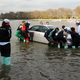 Illustration for article titled Rowers rescue flooded cars during boat race